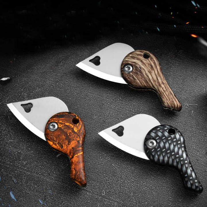 Portachiavi con coltello tascabile pieghevole a forma di cuore con lama cava