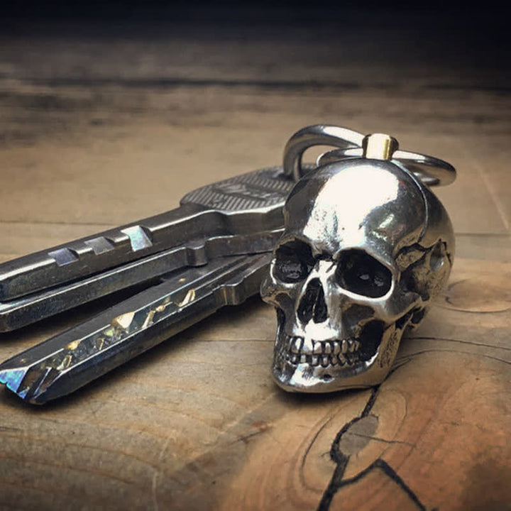 Ciondolo portachiavi girevole con testa di teschio orribile