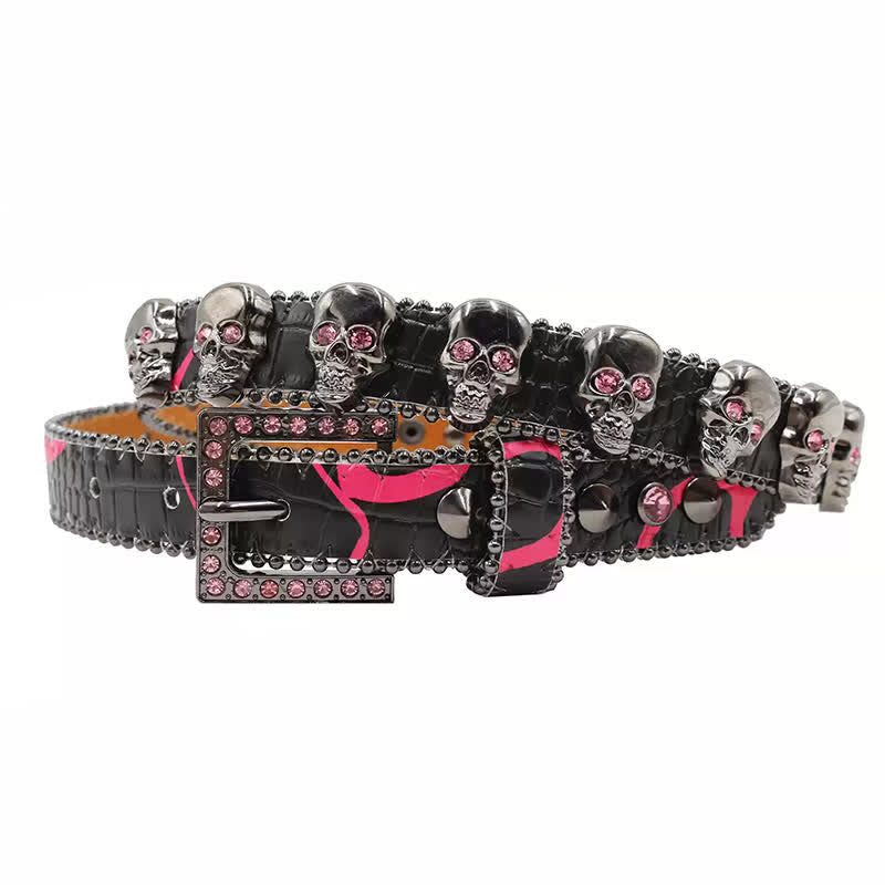 Cintura in pelle con stampa leopardata e rivetti a forma di teschio gotico
