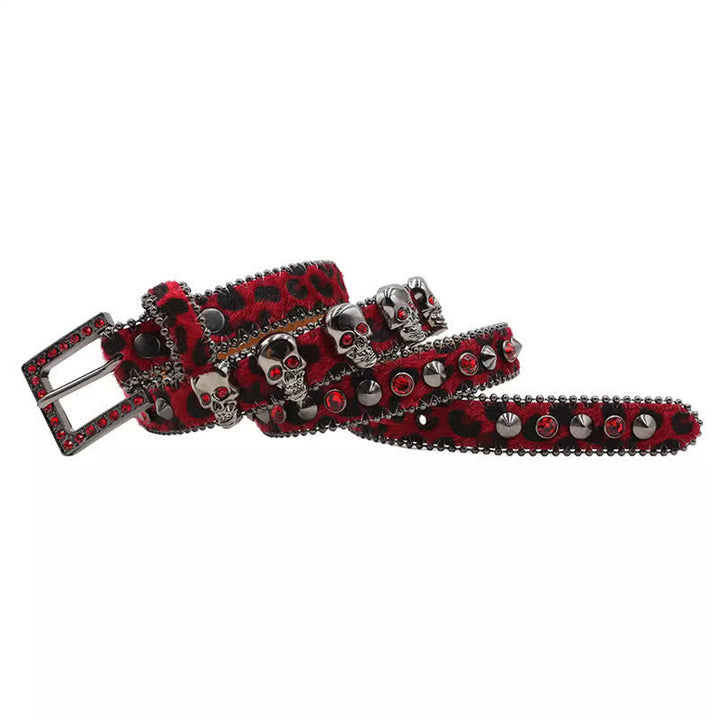 Cintura in pelle con stampa leopardata e rivetti a forma di teschio gotico