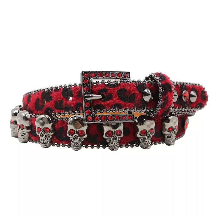 Cintura in pelle con stampa leopardata e rivetti a forma di teschio gotico