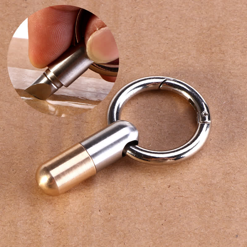 Mini portachiavi con taglierina per disimballaggio a forma di tasca per capsule - Argento e ottone - image 0