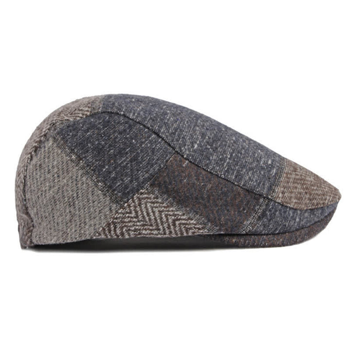 Cappello basco in tweed a spina di pesce con cuciture patchwork