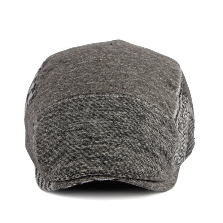 Cappello basco in tweed a spina di pesce con cuciture patchwork