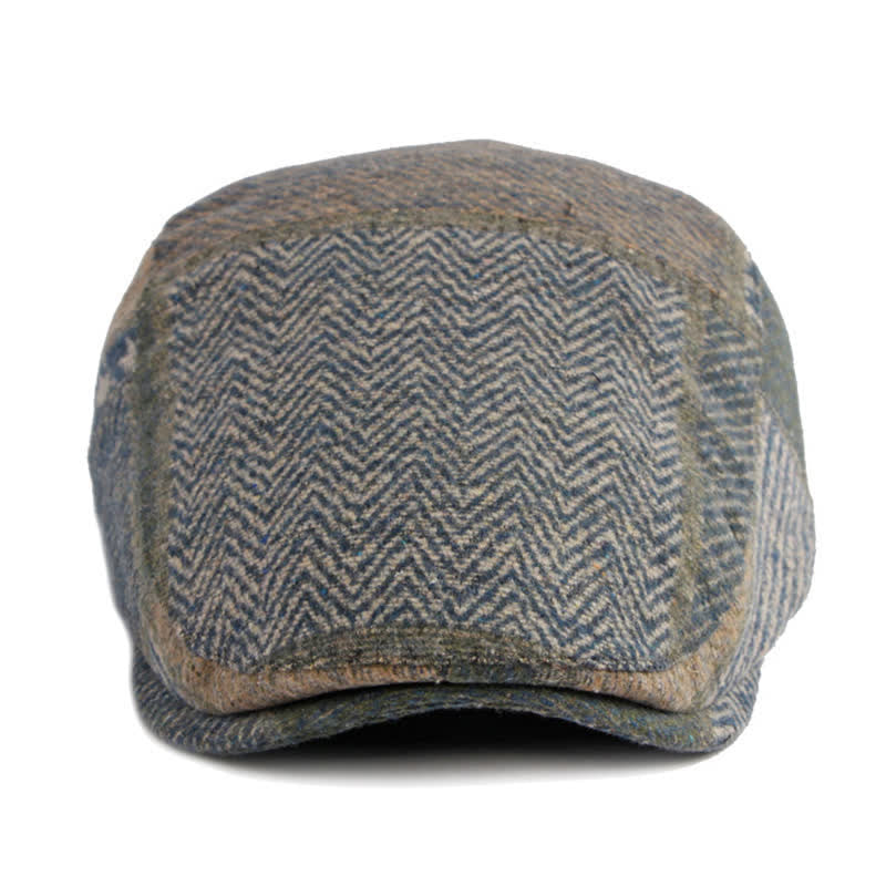 Cappello basco in tweed a spina di pesce con cuciture patchwork
