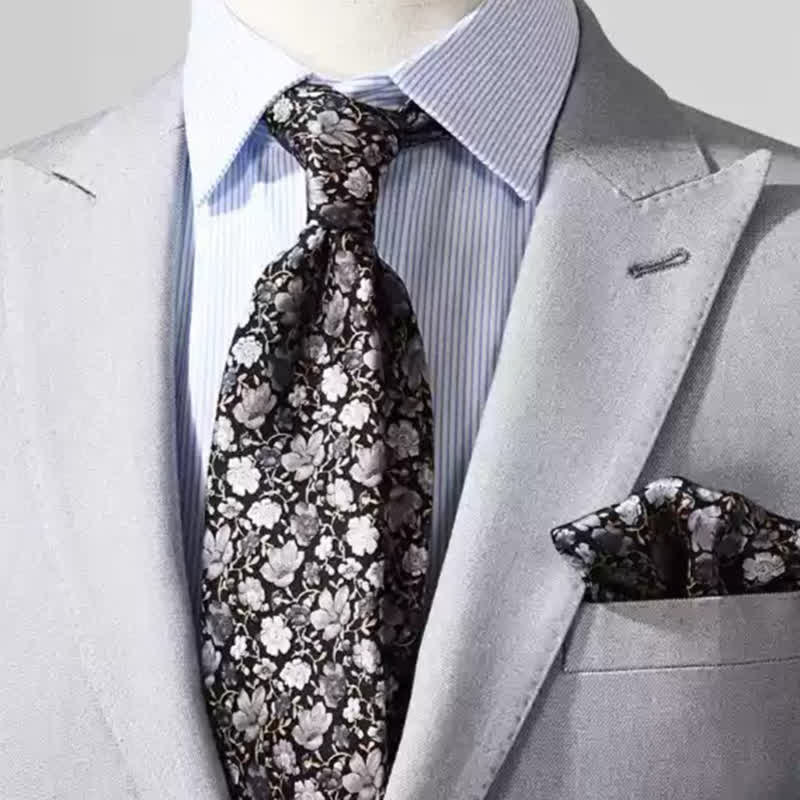 Cravatta da uomo in pura seta con motivo floreale nero e grigio