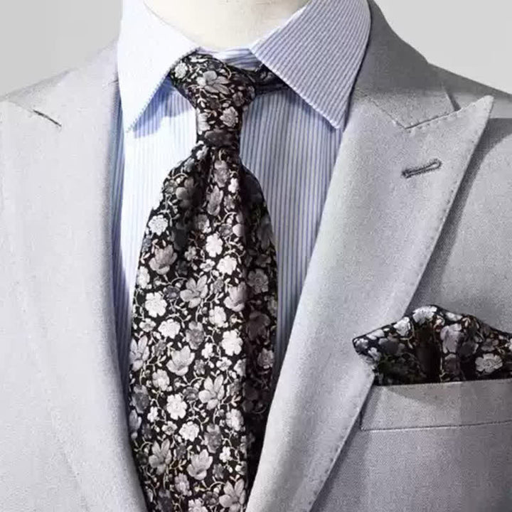Cravatta da uomo in pura seta con motivo floreale nero e grigio