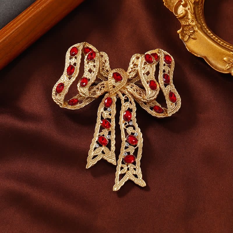 Spilla da donna con fiocco in nastro metallico dorato ondulato - Oro - image 0