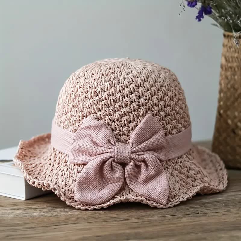 Cappello da sole pieghevole in paglia con nodo a fiocco, lavorato all'uncinetto sulla spiaggia