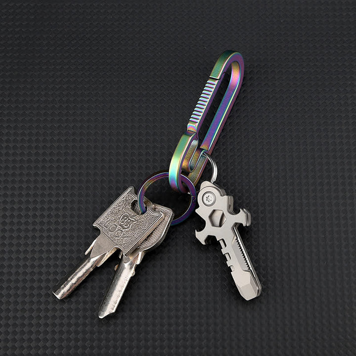Portachiavi con mini coltello pieghevole multifunzionale in titanio Cross