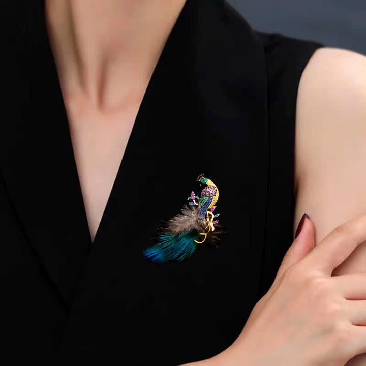 Spilla a forma di piuma di pavone con strass scintillanti da donna