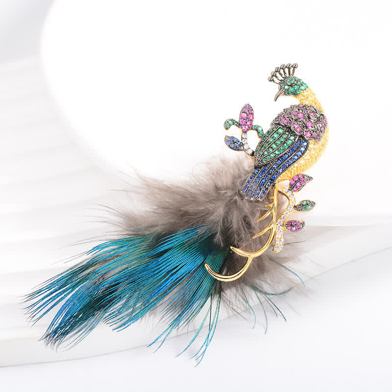 Spilla a forma di piuma di pavone con strass scintillanti da donna