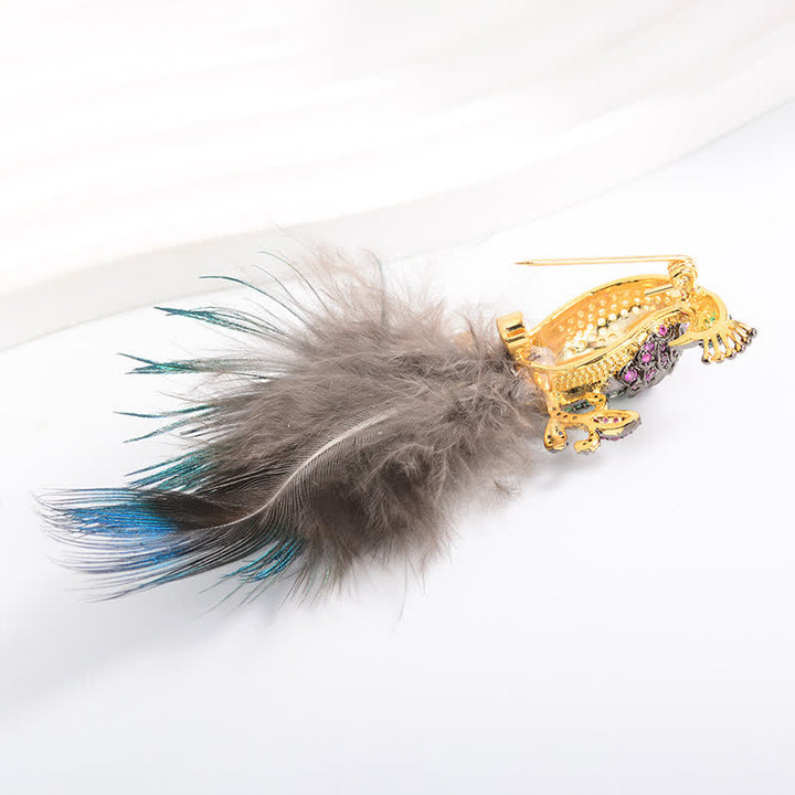 Spilla a forma di piuma di pavone con strass scintillanti da donna