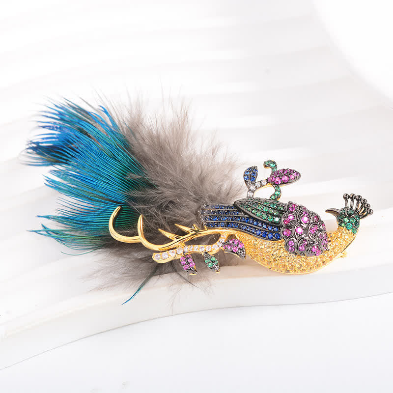 Spilla a forma di piuma di pavone con strass scintillanti da donna