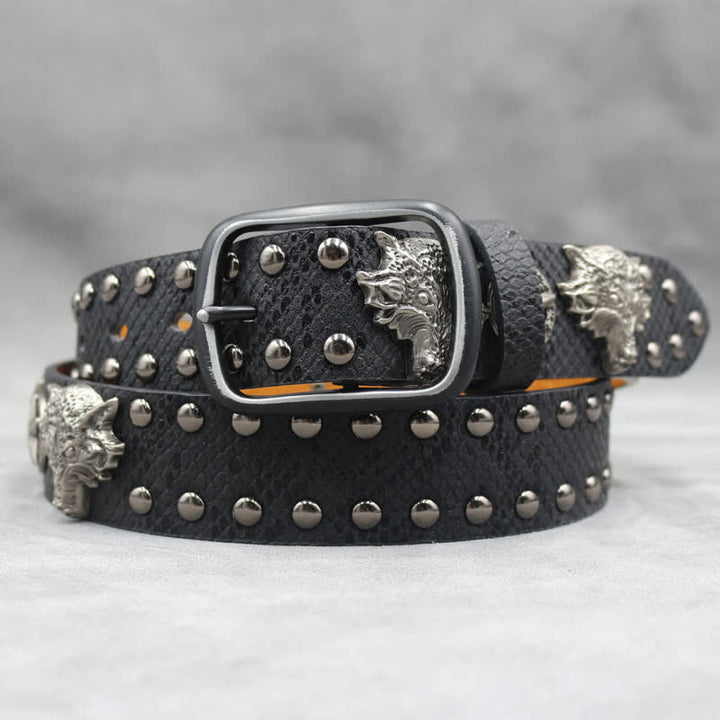 Cintura in pelle stampata in pelle di serpente nera con rivetto a testa di lupo in argento antico