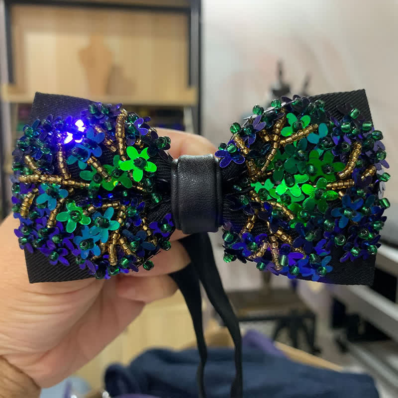Papillon con paillettes a forma di fiore verde e blu scintillanti