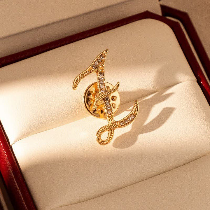 Spilla con lettera iniziale in oro 26 dell'alfabeto con strass