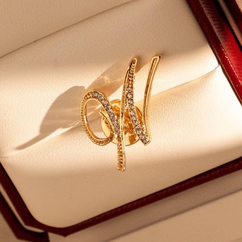 Spilla con lettera iniziale in oro 26 dell'alfabeto con strass