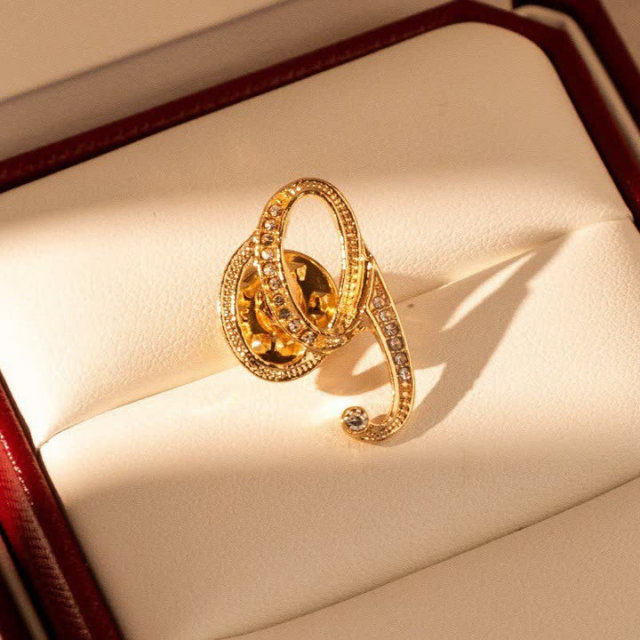 Spilla con lettera iniziale in oro 26 dell'alfabeto con strass