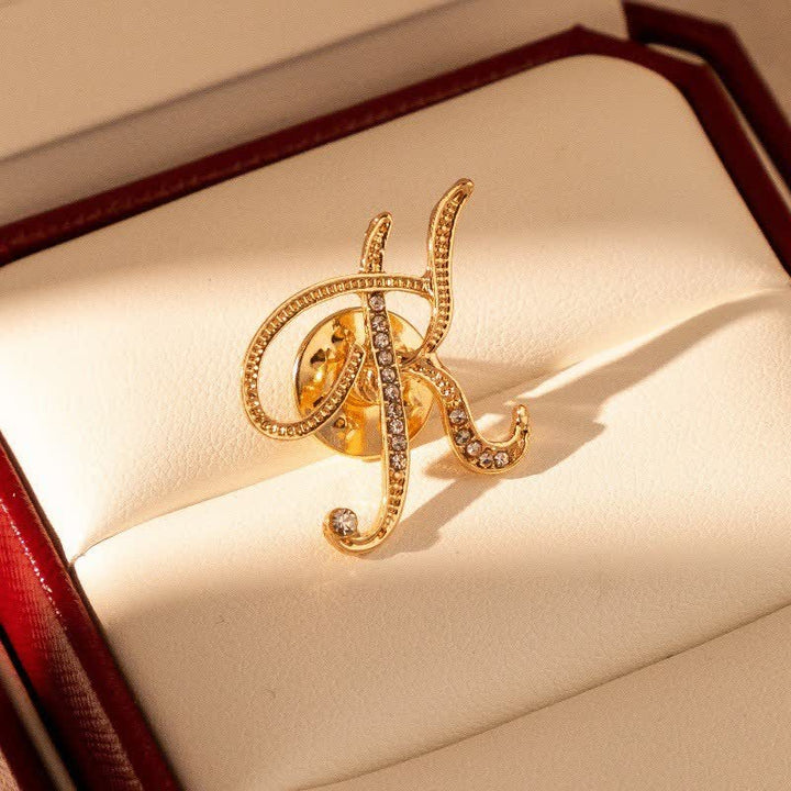 Spilla con lettera iniziale in oro 26 dell'alfabeto con strass