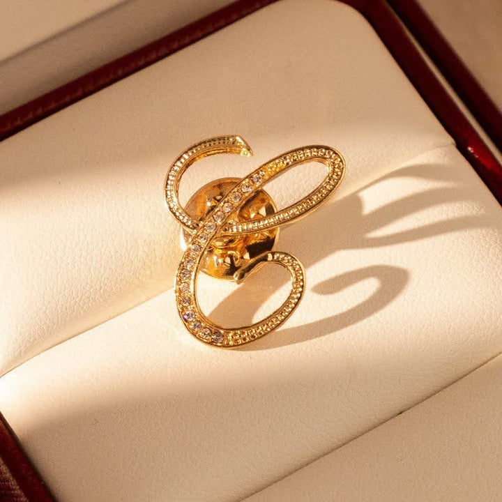 Spilla con lettera iniziale in oro 26 dell'alfabeto con strass