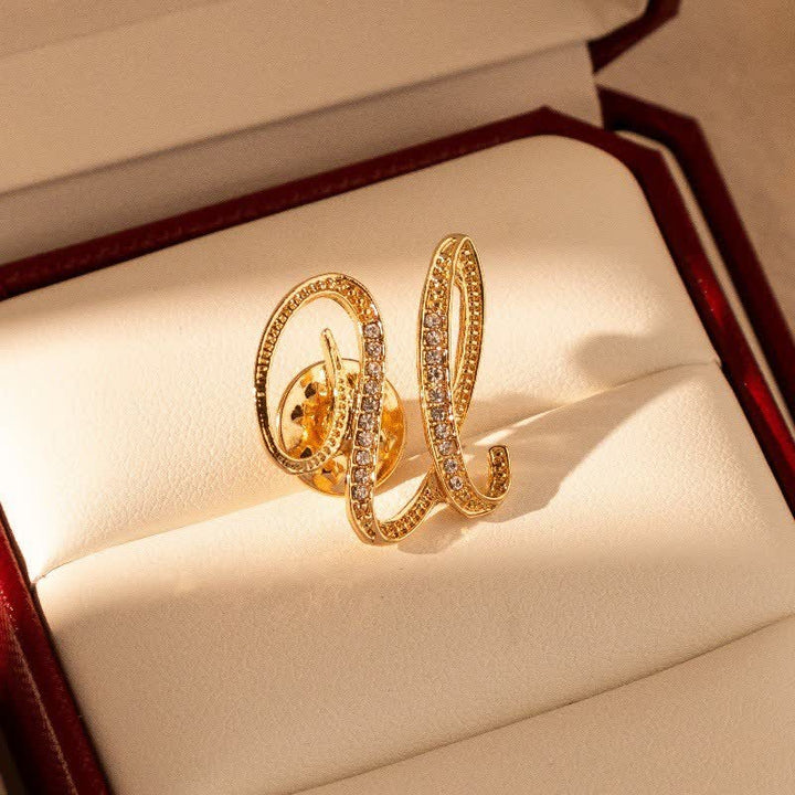 Spilla con lettera iniziale in oro 26 dell'alfabeto con strass