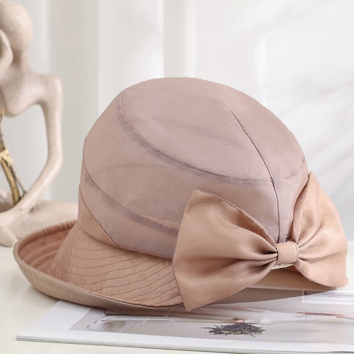 Cappello da sole pieghevole in seta con tesa larga e nodo a fiocco grande da donna