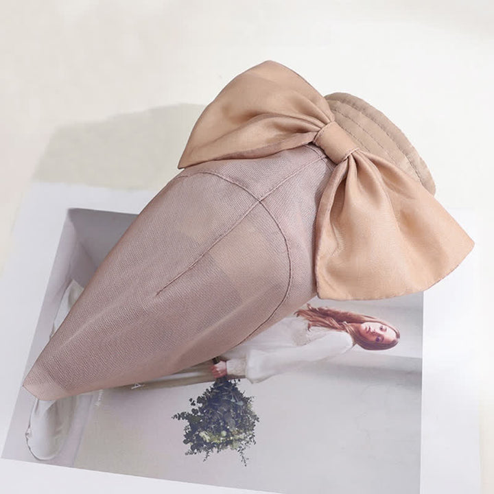 Cappello da sole pieghevole in seta con tesa larga e nodo a fiocco grande da donna