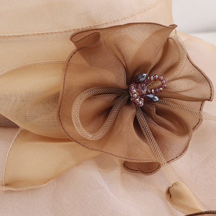 Cappello da sole da donna in seta pieghevole con tesa larga e ondulata e motivo floreale