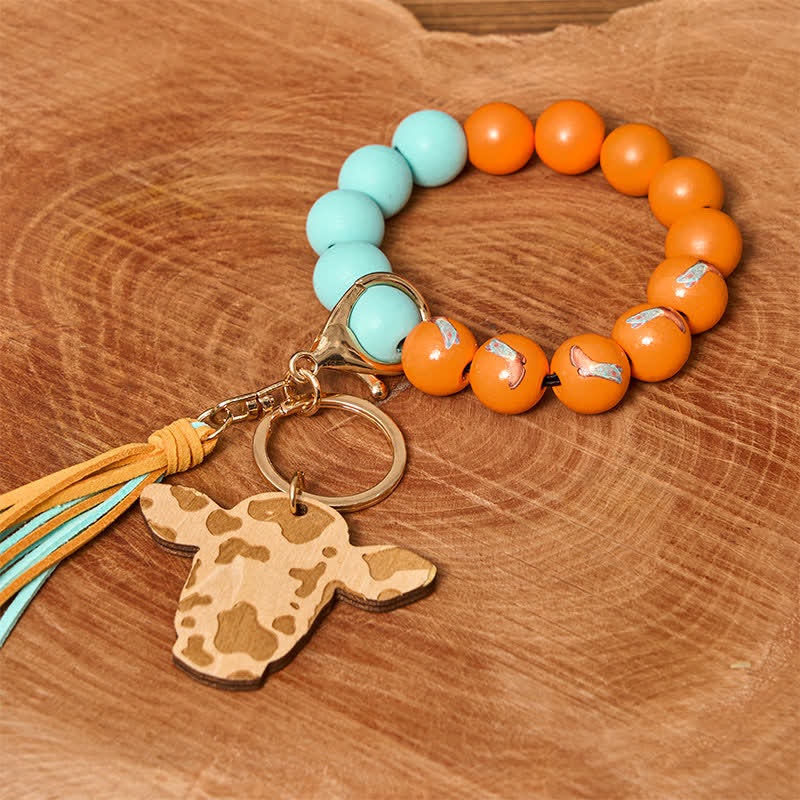 Bracciale da polso in perline di legno di mucca con nappa