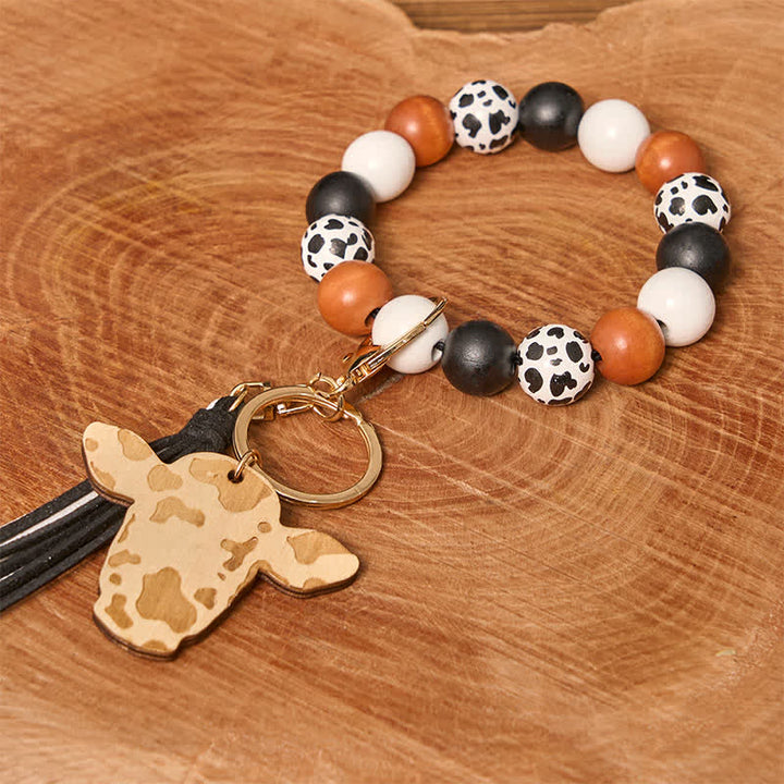 Bracciale da polso in perline di legno di mucca con nappa - Mucca bianca - image 1