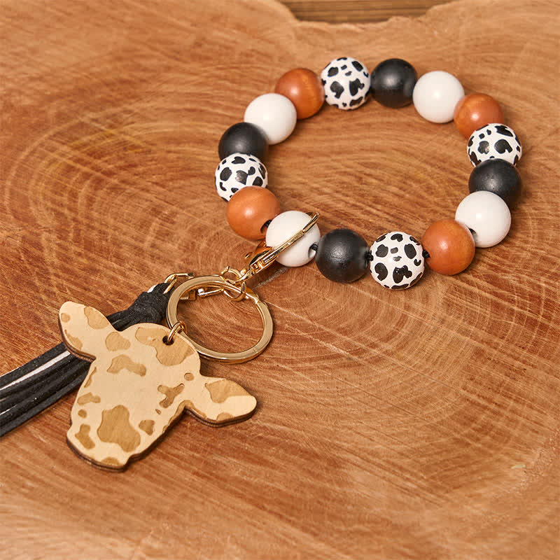 Bracciale da polso in perline di legno di mucca con nappa - Mucca bianca - image 1