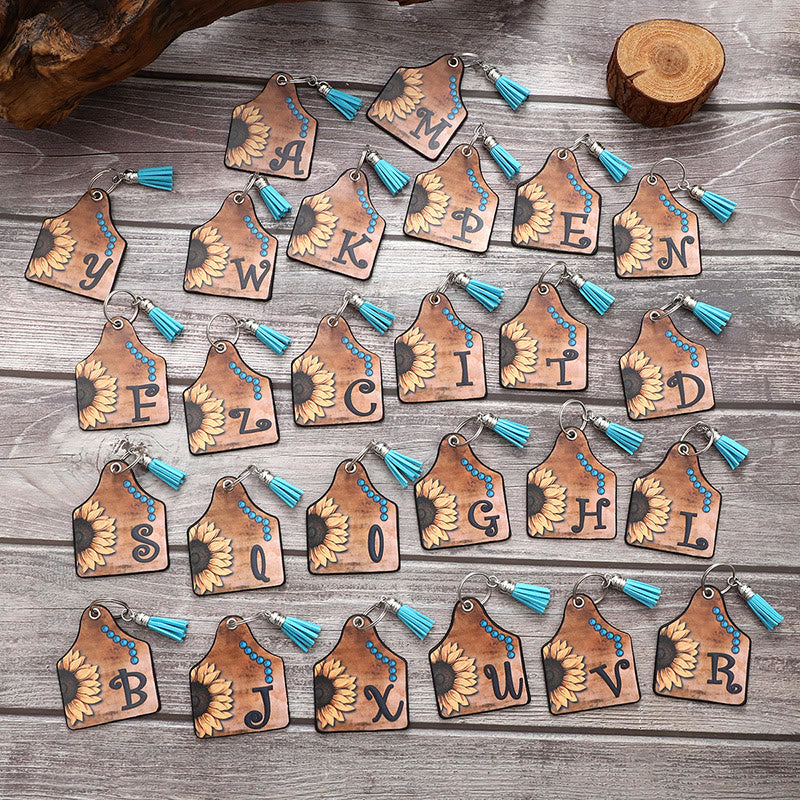 Portachiavi in pelle con nappa a forma di girasole e lettera in stile occidentale - image 1