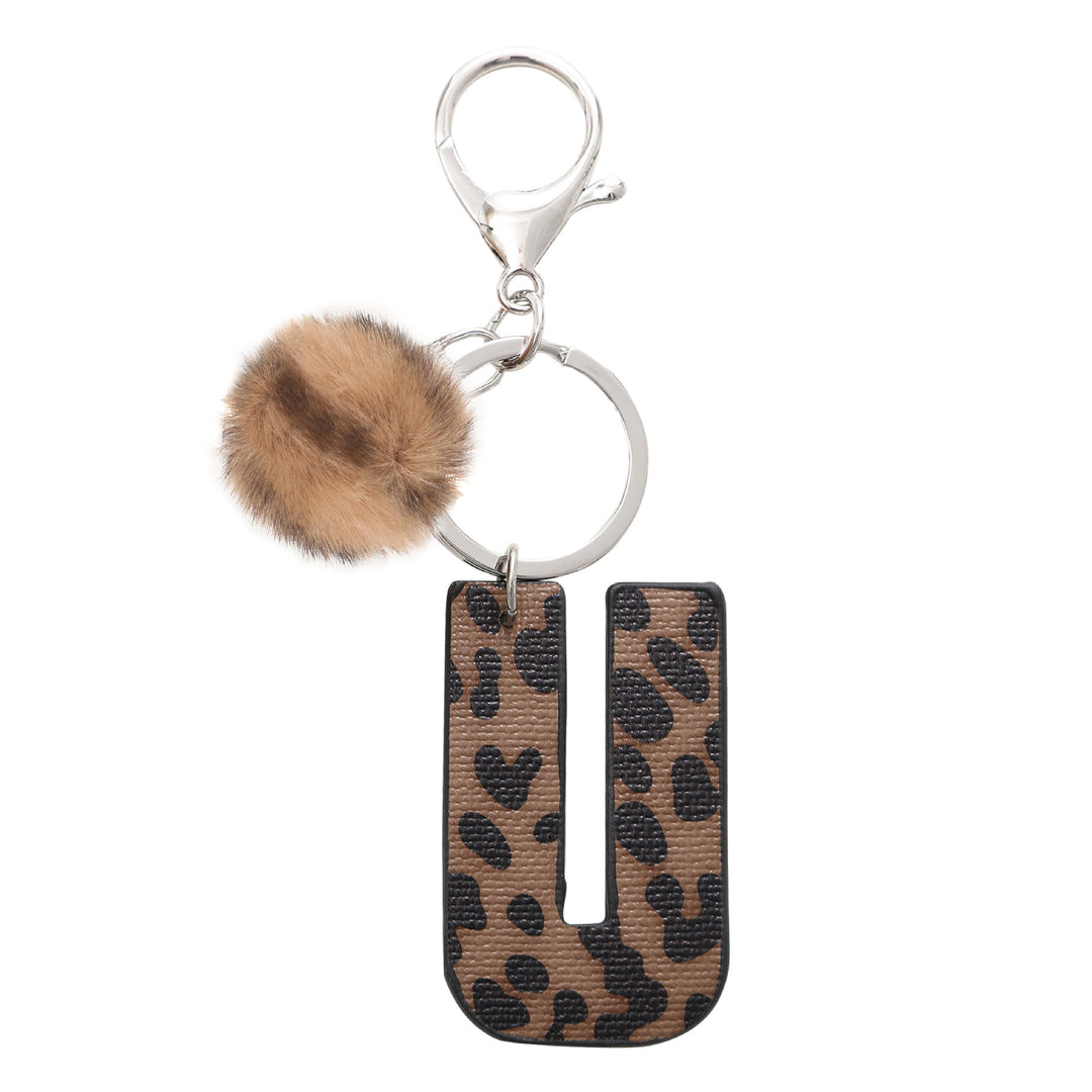 Portachiavi in pelle con lettera stampata leopardata in stile western e palla di peluche - U - image 22