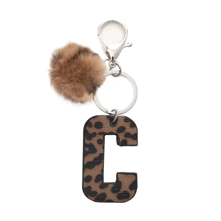 Portachiavi in pelle con lettera stampata leopardata in stile western e palla di peluche - C - image 5