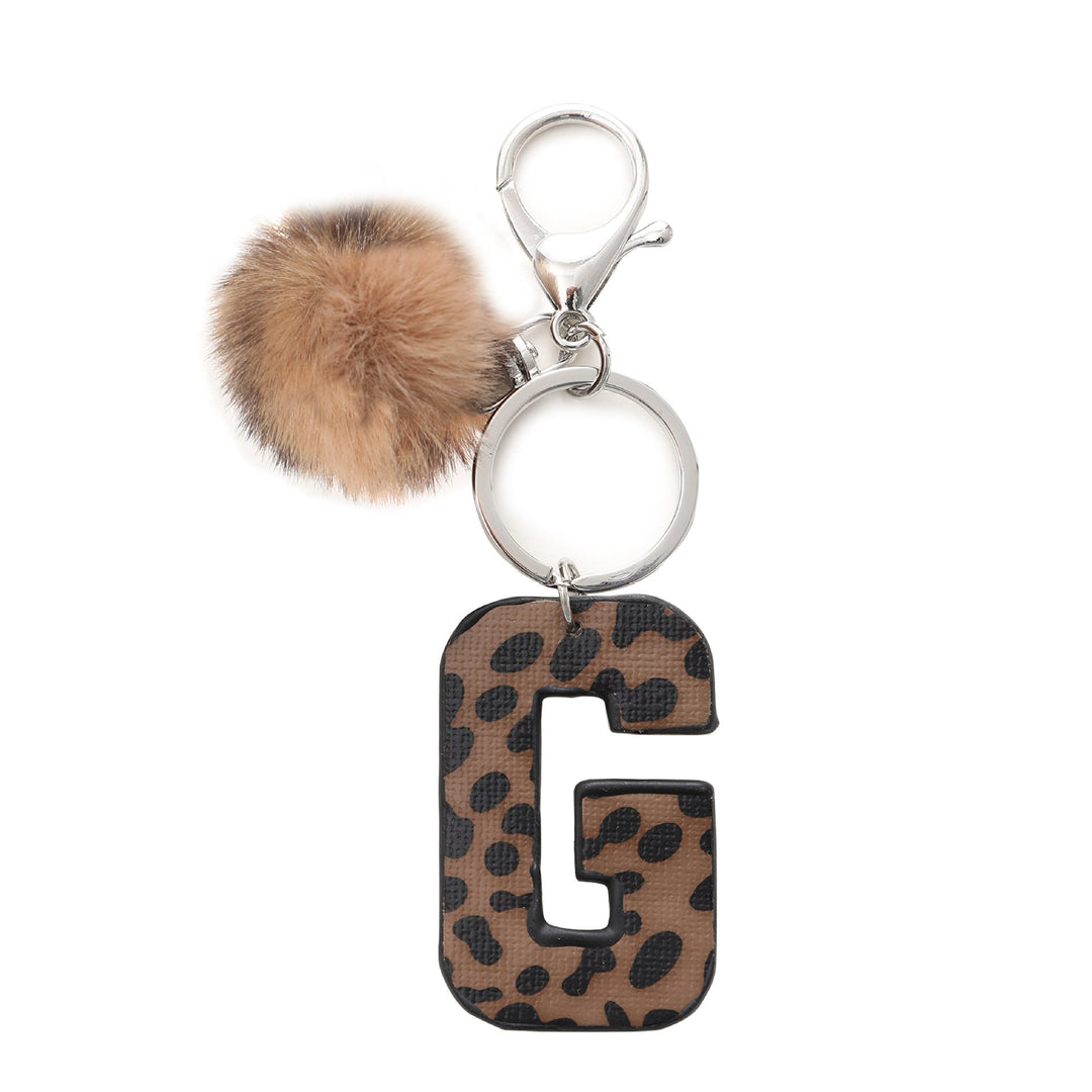 Portachiavi in pelle con lettera stampata leopardata in stile western e palla di peluche - G - image 9
