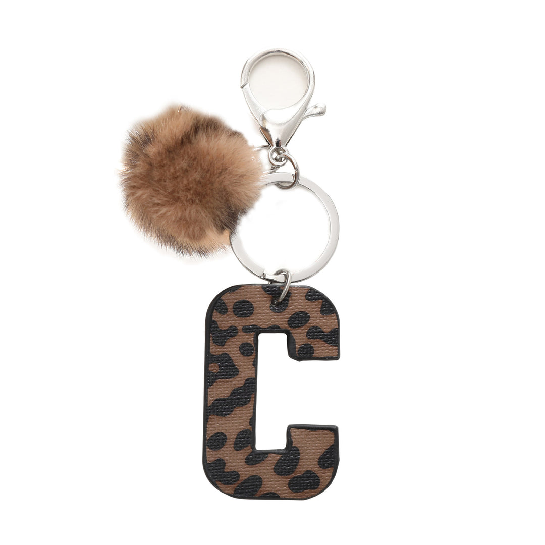 Portachiavi in pelle con lettera stampata leopardata in stile western e palla di peluche - C - image 4