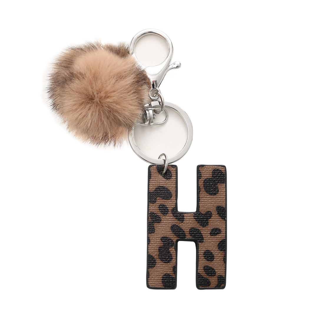 Portachiavi in pelle con lettera stampata leopardata in stile western e palla di peluche - H - image 9