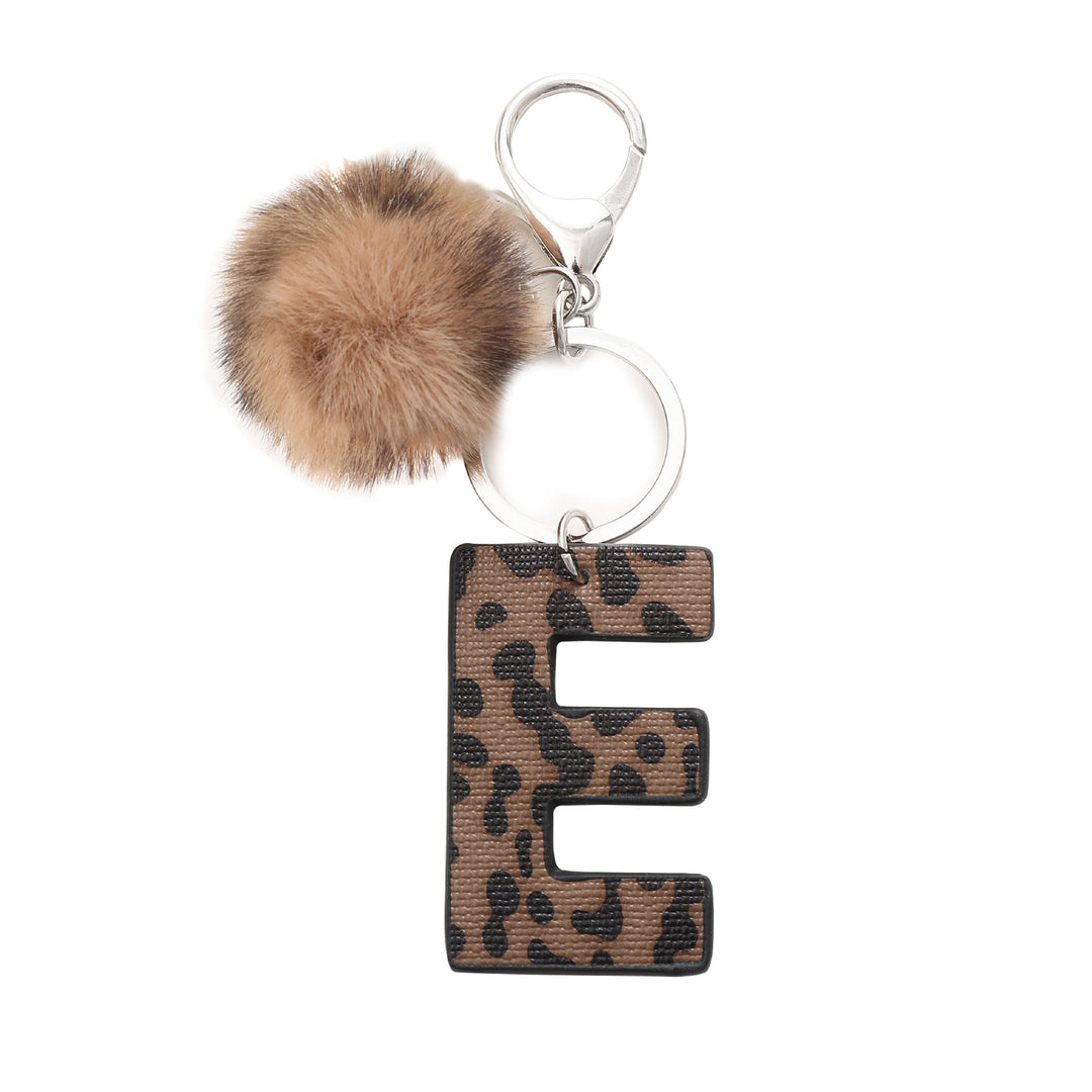 Portachiavi in pelle con lettera stampata leopardata in stile western e palla di peluche - E - image 7