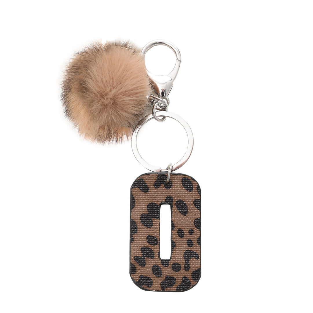 Portachiavi in pelle con lettera stampata leopardata in stile western e palla di peluche - O - image 17