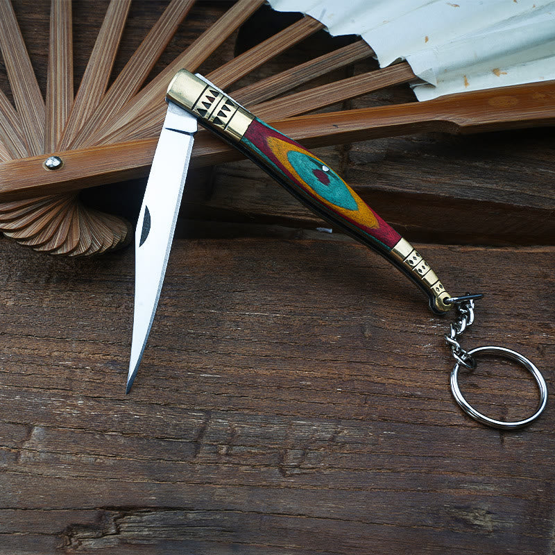 Coltello pieghevole in ottone colorato con mano di Buddha e collana in pietra rossa - image 5