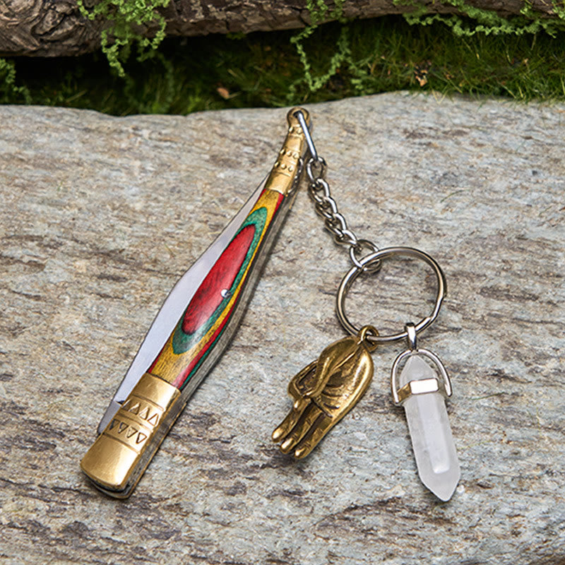 Coltello pieghevole da esterno con manico colorato e collana con mano di Buddha in cristallo bianco - image 2