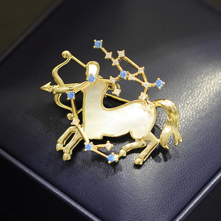 Spilla in oro con 12 costellazioni in madreperla e cristallo blu - image 17