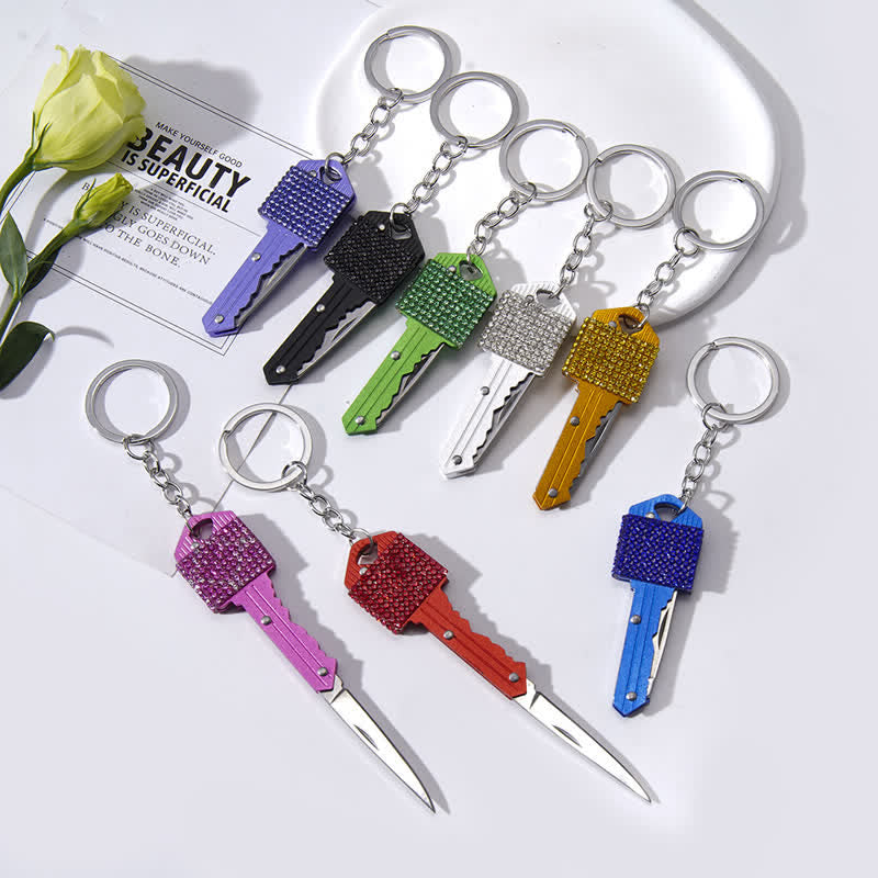 Portachiavi a forma di coltello pieghevole con strass brillanti - image 0