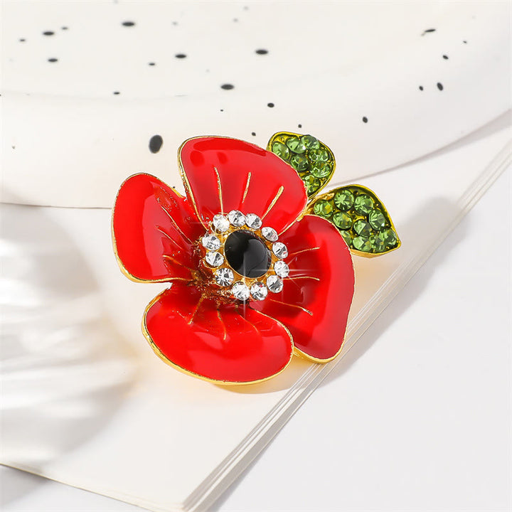 Spilla con bordo dorato a forma di foglia di papavero rosso brillante, decorata con cristalli scintillanti e petali lucidi - image 1