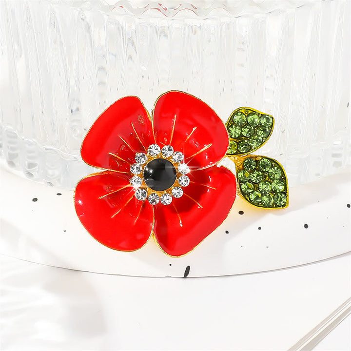 Spilla con bordo dorato a forma di foglia di papavero rosso brillante, decorata con cristalli scintillanti e petali lucidi - image 2