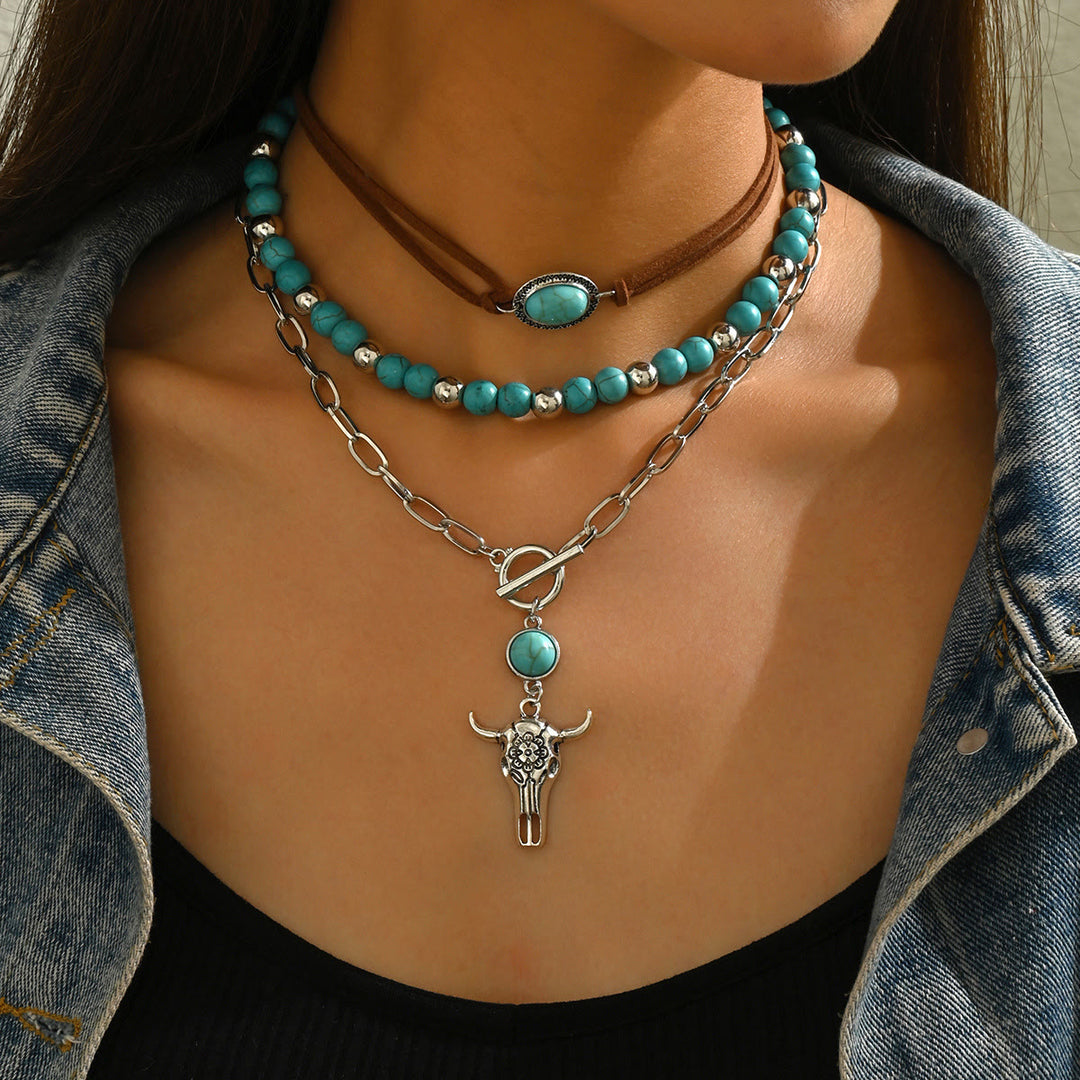 Collana in stile occidentale con ciondolo a forma di teschio di mucca in argento e perlina turchese - image 1