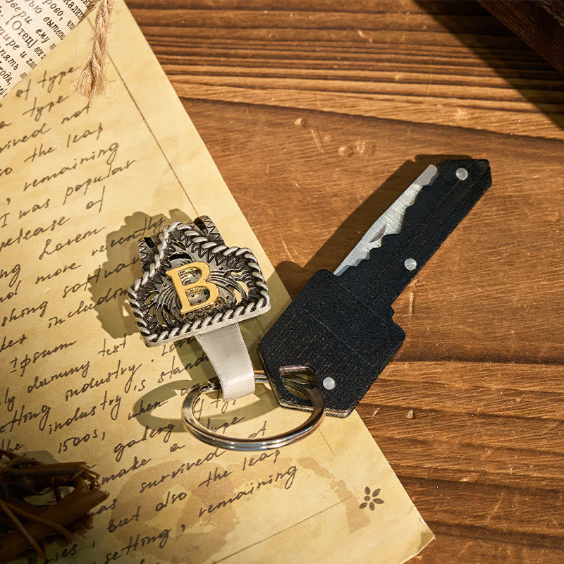Portachiavi con lettera retrò western e coltello a forma di chiave - image 1