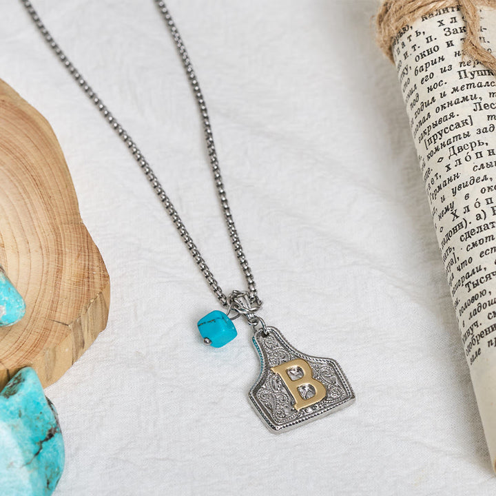 Collana con ciondolo turchese a forma di lettera bicolore in stile occidentale - image 3