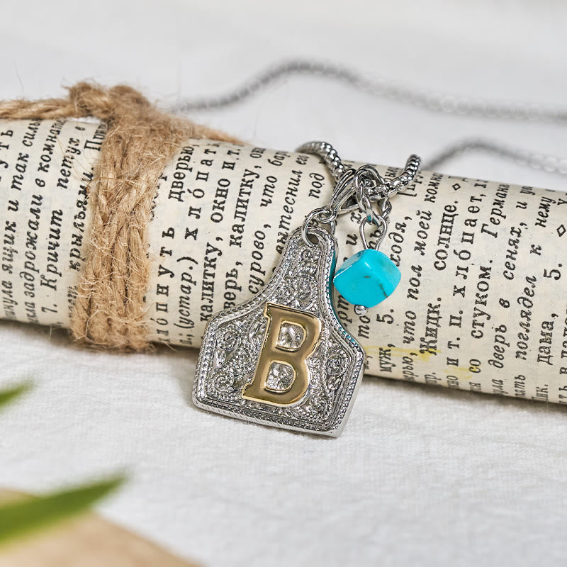 Collana con ciondolo turchese a forma di lettera bicolore in stile occidentale - image 1